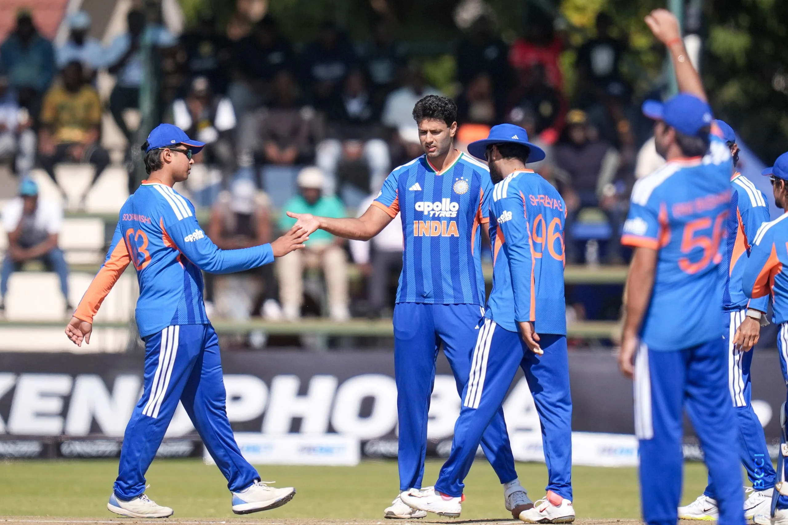 Shivam Dube of India celebrates the wicket of Sikandar Raza (C) of Zimbabwe during the 1st T20 International match between Zimbabwe and India at the Harare Sports Club, Harare, Zimbabwe on July 23, 2026.Photo: Faheem Hussain / CREIMAS for BCCI